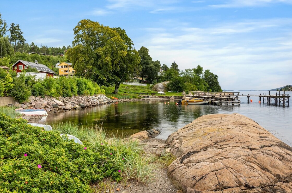 Shoreline and dock beneath the villa